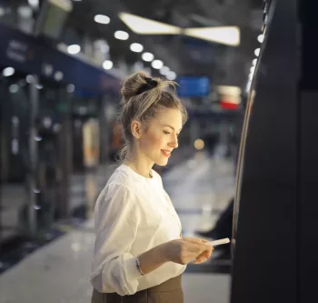 woman-buys-ticket-subway woman-buys-ticket-subway